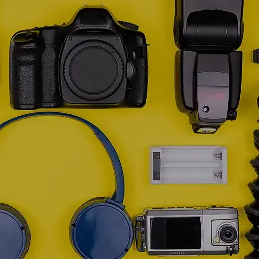 Assorted cameras, headphones and electronic devices